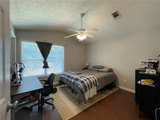 1385 S Donahue Dr Unit 4201, Auburn, AL 36832 - bedroom featuring wood finished floors, an office area, vaulted ceiling, baseboards, and a textured ceiling