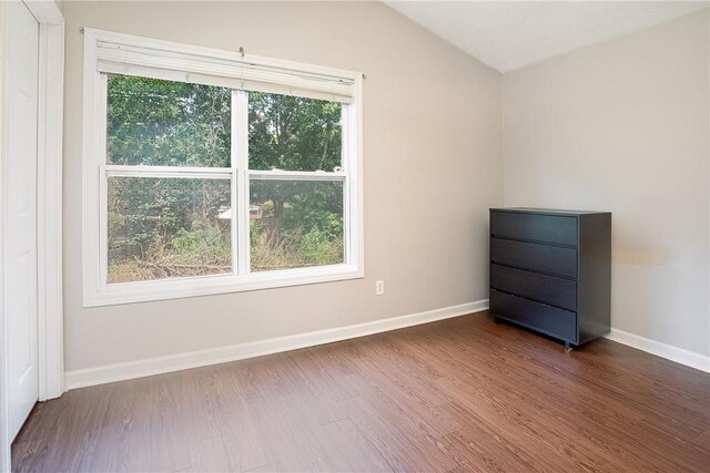 1385 S Donahue Dr Unit 4201, Auburn, AL 36832 - unfurnished room with wood finished floors and vaulted ceiling