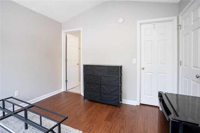 1385 S Donahue Dr Unit 4201, Auburn, AL 36832 - bedroom featuring lofted ceiling and dark wood-style flooring