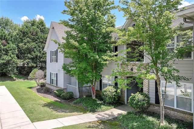 1385 S Donahue Dr Unit 4201, Auburn, AL 36832 - view of front of house with a front lawn, a garage, and a shingled roof