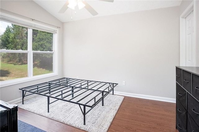 1385 S Donahue Dr Unit 4201, Auburn, AL 36832 - unfurnished bedroom with dark wood-type flooring, lofted ceiling, and a ceiling fan