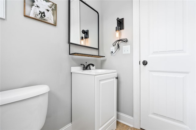 2674 Canal Ct, Auburn, AL 36830 - bathroom with baseboards, vanity, and toilet