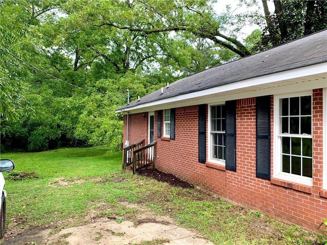 view of property exterior with a lawn