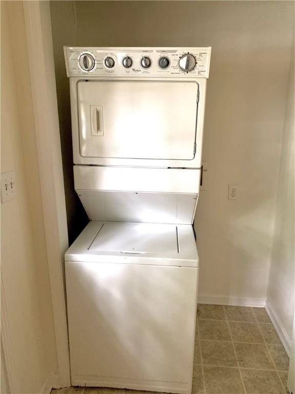 laundry area with stacked washer / dryer