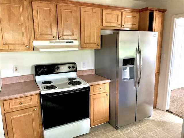 kitchen with stainless steel fridge, light tile patterned floors, and white electric range oven