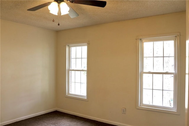 unfurnished room featuring a textured ceiling, ceiling fan, carpet, and baseboards