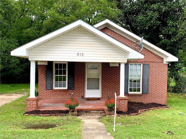 view of front of house featuring a front yard and a porch