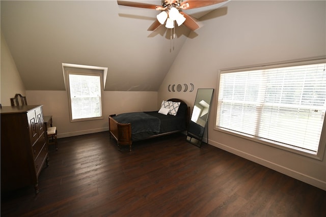 bedroom with multiple windows, dark hardwood / wood-style flooring, ceiling fan, and lofted ceiling