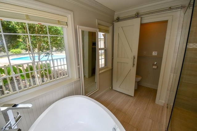 1900 Wrights Mill Rd, Auburn, AL 36830 - full bath featuring a soaking tub, plenty of natural light, wainscoting, and crown molding