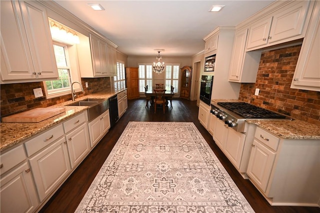 1900 Wrights Mill Rd, Auburn, AL 36830 - kitchen with black appliances, a chandelier, dark wood finished floors, light stone counters, and backsplash
