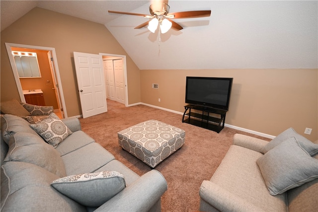 carpeted living room featuring ceiling fan and vaulted ceiling