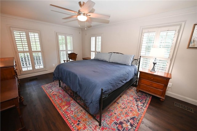 bedroom featuring ceiling fan, dark hardwood / wood-style flooring, and ornamental molding