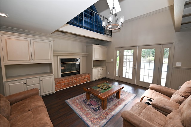 1900 Wrights Mill Rd, Auburn, AL 36830 - living area featuring a towering ceiling, a chandelier, dark wood finished floors, ornamental molding, and a fireplace