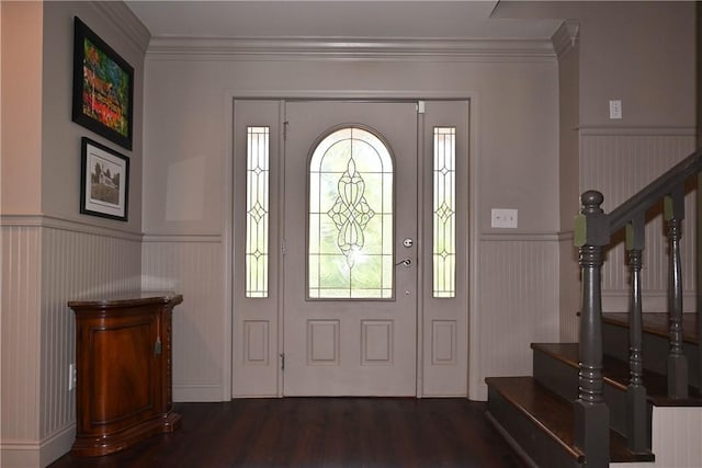 entryway with dark hardwood / wood-style floors and crown molding