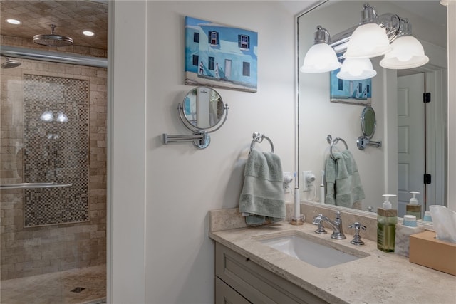 bathroom featuring vanity and a shower with shower door