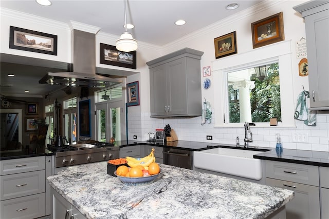 kitchen featuring dark stone counters, gray cabinetry, sink, and stainless steel dishwasher