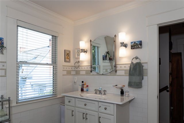 bathroom with vanity, tile walls, and ornamental molding