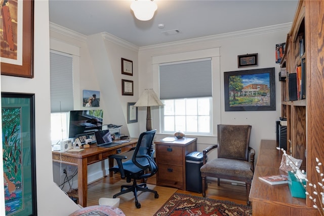 office area featuring hardwood / wood-style flooring and ornamental molding