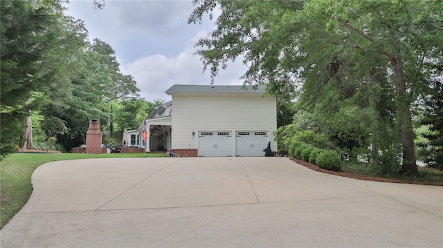 view of side of property featuring a garage