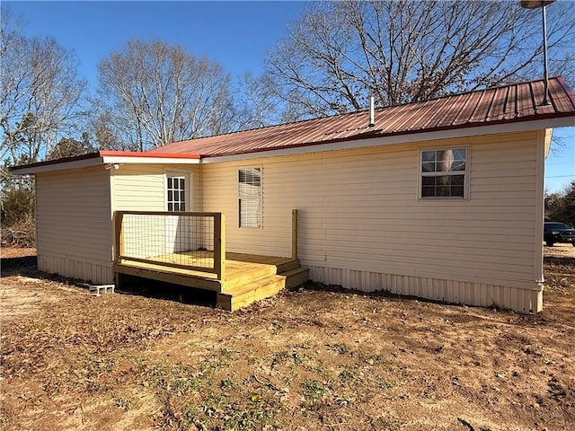 rear view of property with a deck