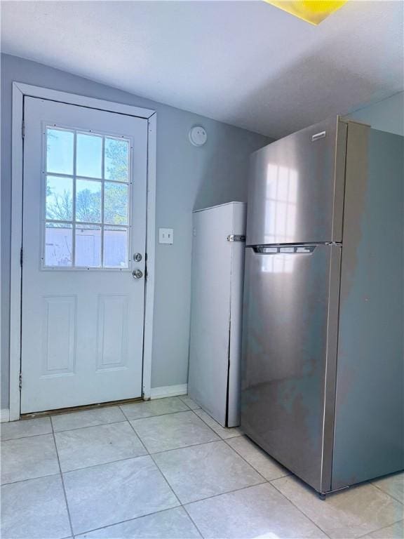 entryway featuring light tile patterned floors