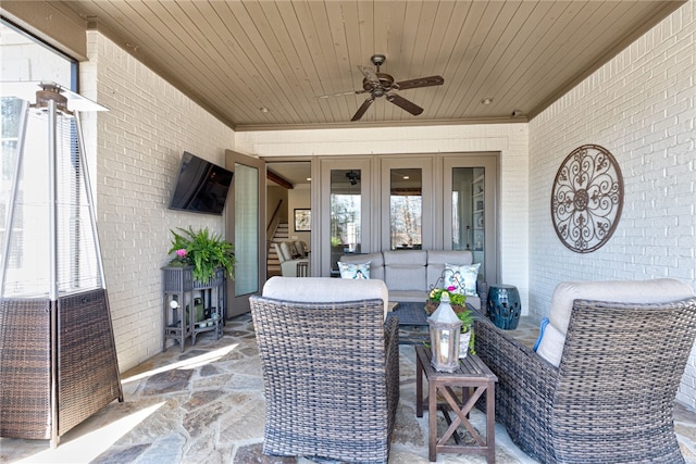 view of patio with outdoor lounge area and a ceiling fan