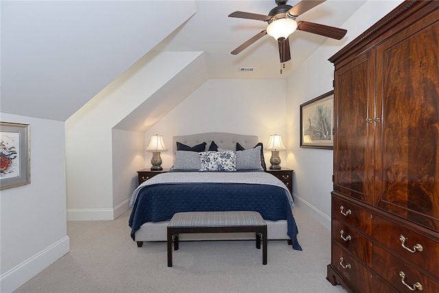 bedroom featuring light carpet, visible vents, baseboards, a ceiling fan, and lofted ceiling