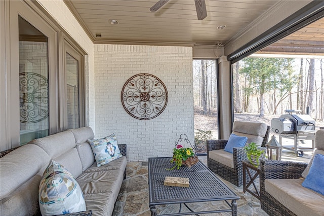 view of patio / terrace featuring ceiling fan, an outdoor living space, and area for grilling