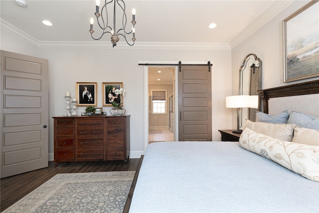 bedroom with a barn door, baseboards, ornamental molding, wood finished floors, and an inviting chandelier