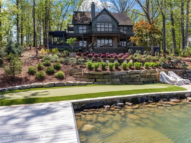 522 Ridgeway Dr, Eclectic, AL 36024 - living area with high vaulted ceiling, baseboards, a ceiling fan, a stone fireplace, and wood finished floors