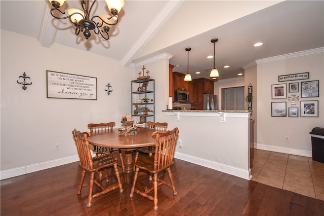 dining room featuring crown molding, vaulted ceiling, dark wood-type flooring, and a chandelier