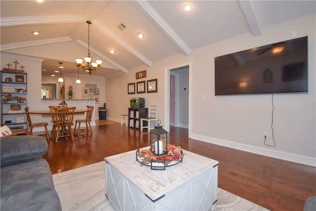 living room with hardwood / wood-style flooring, a chandelier, and lofted ceiling with beams