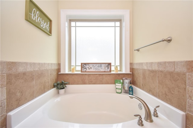 bathroom featuring a washtub