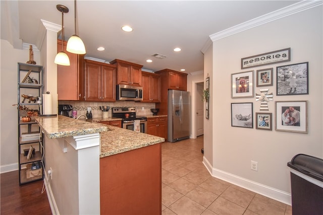 kitchen with a breakfast bar, decorative light fixtures, kitchen peninsula, stainless steel appliances, and light stone countertops