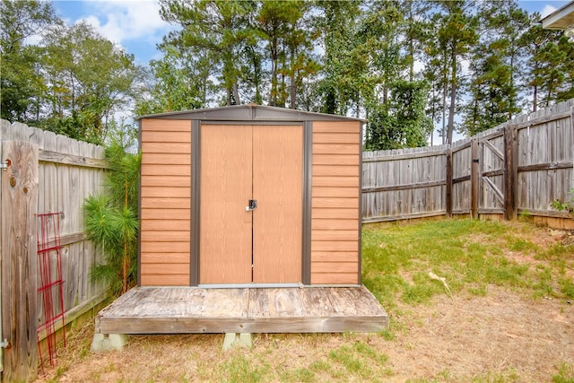 view of outbuilding with a lawn