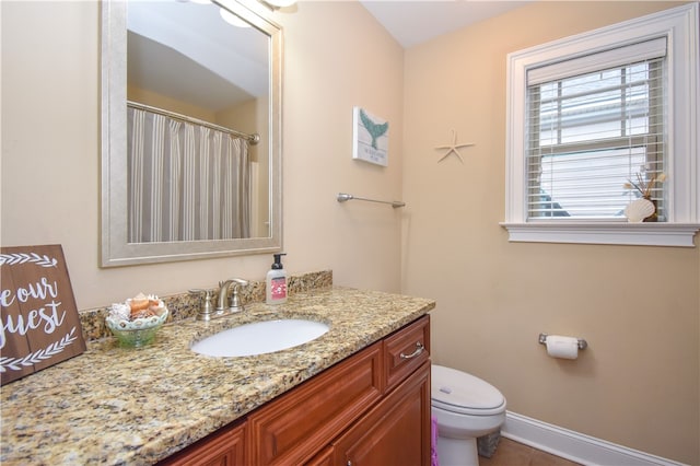 bathroom with vanity and toilet