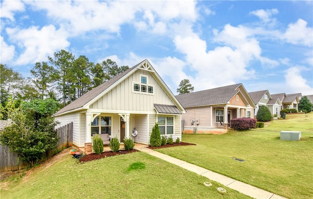 craftsman inspired home with a porch and a front yard