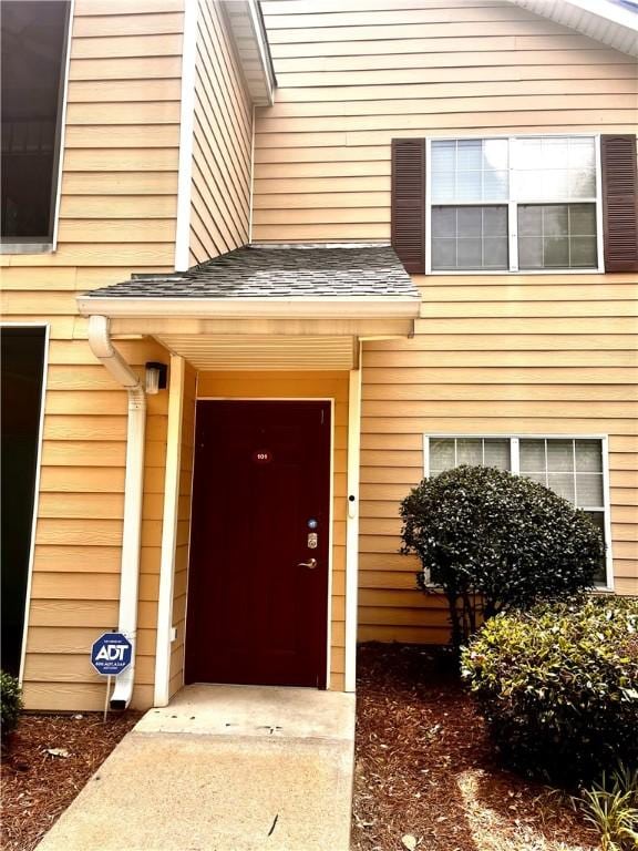 447 W Longleaf Dr Unit 101, Auburn, AL 36832 - doorway to property featuring a shingled roof
