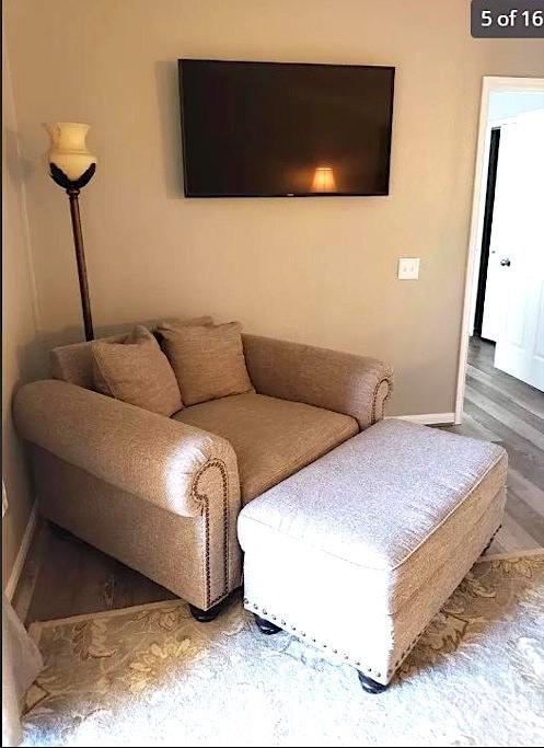 447 W Longleaf Dr Unit 101, Auburn, AL 36832 - living room featuring baseboards and wood finished floors