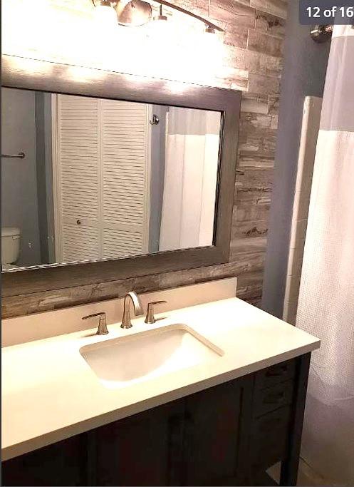447 W Longleaf Dr Unit 101, Auburn, AL 36832 - bathroom with vanity and toilet
