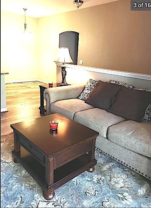 447 W Longleaf Dr Unit 101, Auburn, AL 36832 - living area with baseboards and wood finished floors