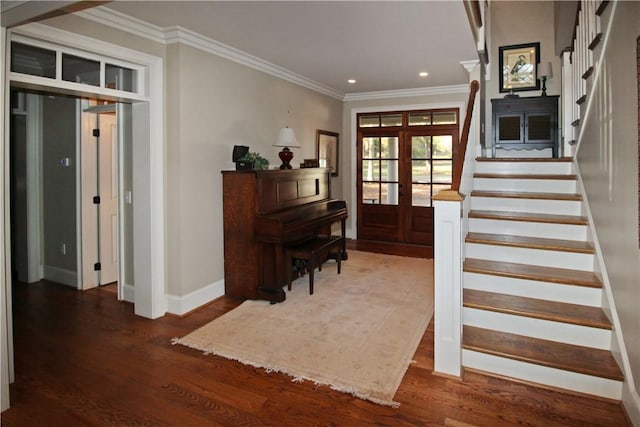 foyer featuring french doors, crown molding, and dark wood-type flooring