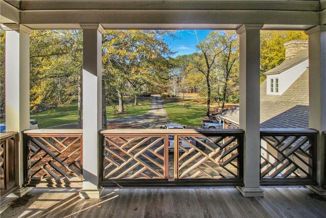 doorway with hardwood / wood-style flooring