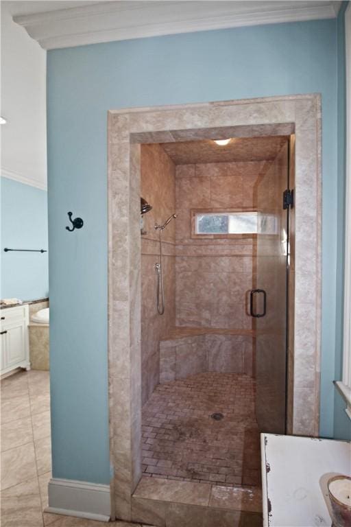 bathroom featuring vanity, ornamental molding, and walk in shower