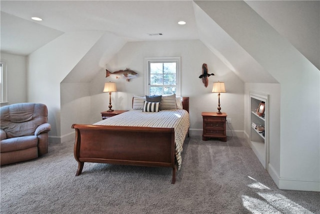 bedroom with dark carpet and vaulted ceiling