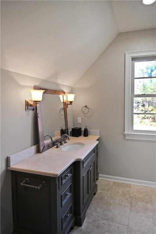 bathroom featuring vanity and vaulted ceiling