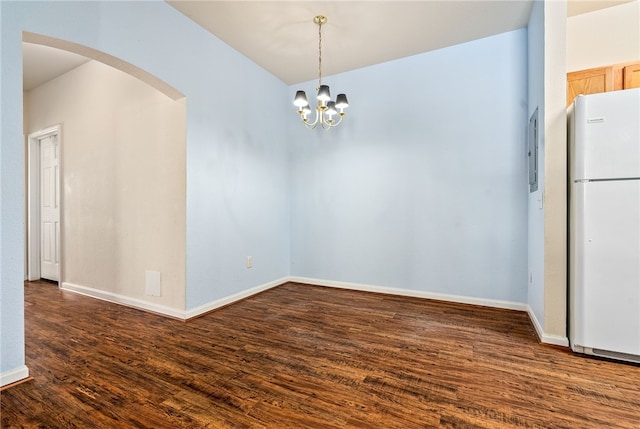 447 W Longleaf Dr Unit 1007, Auburn, AL 36832 - unfurnished dining area with arched walkways, dark wood-style flooring, baseboards, and a chandelier