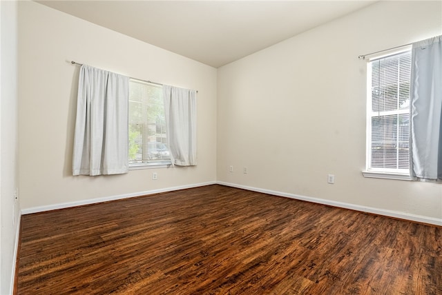447 W Longleaf Dr Unit 1007, Auburn, AL 36832 - empty room with dark wood-style floors and baseboards