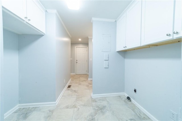 washroom with cabinets, crown molding, and electric dryer hookup