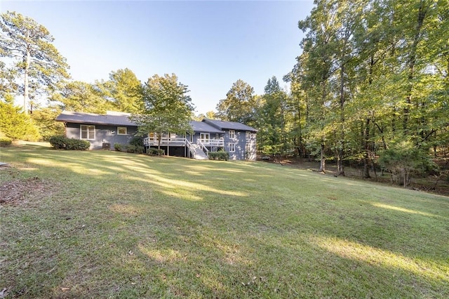 view of yard featuring a wooden deck